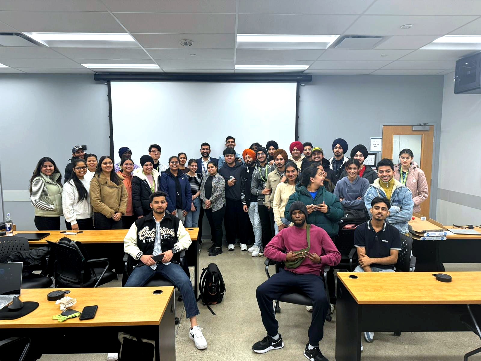 A large group of ScholarDigit learners together in a classroom